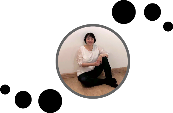 lori jejune lady sitting on floor black circles